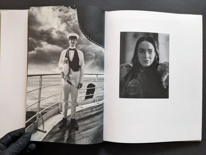 Gatefold with a sailor on a ship deck and a close portrait of a female character in black and white.