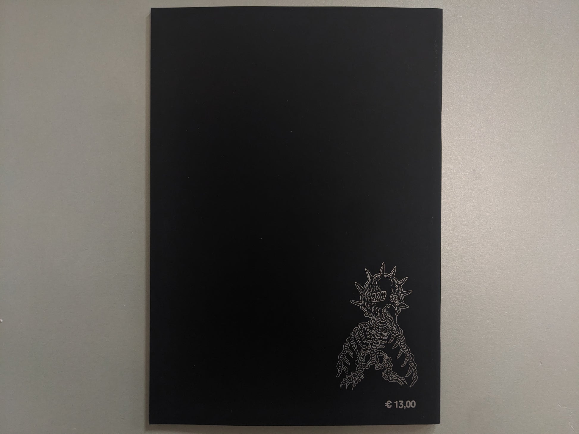 Back cover of Dimensional Flats on black ground, with a skeletal mutant and printed price.