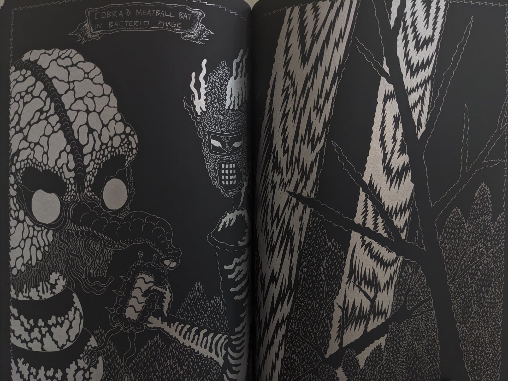 Spread with alien creatures labeled Cobra & Meatball Bat inside a bacteriophage-like environment.
