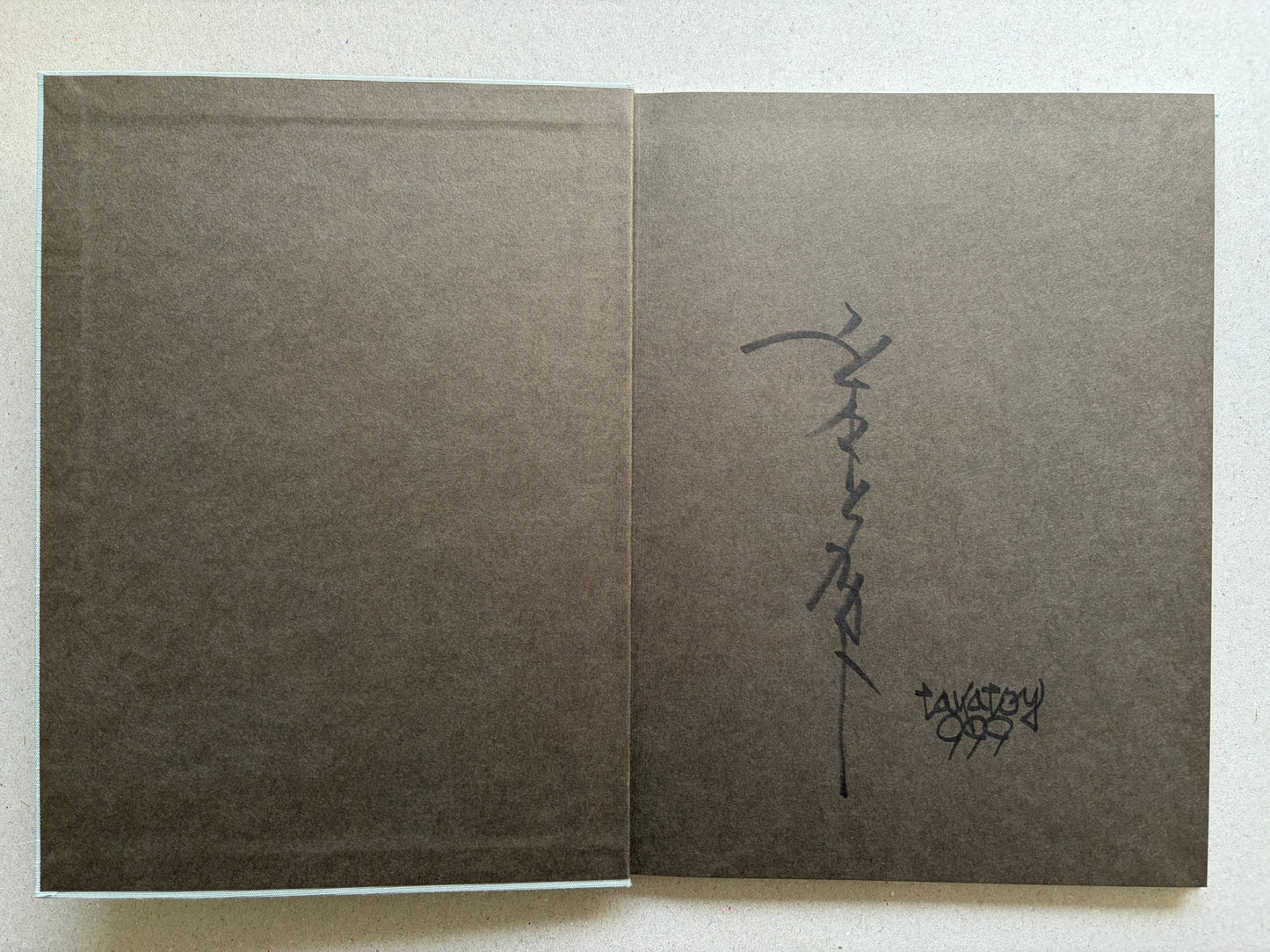 Divertimento for a Martyr – Takato Yamamoto New Black Edition, charcoal-grey endpapers with signed page