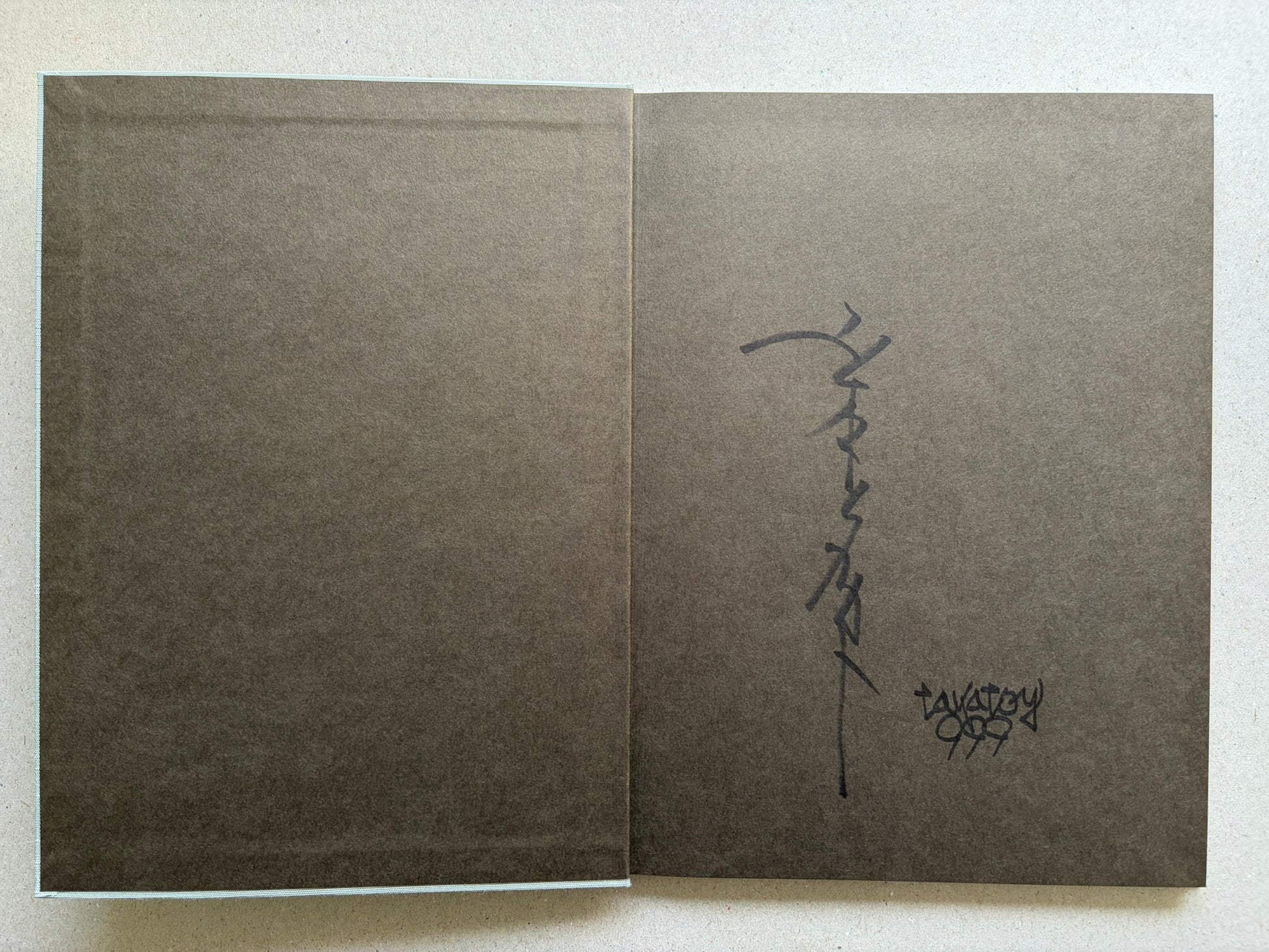 Divertimento for a Martyr – Takato Yamamoto New Black Edition, charcoal-grey endpapers with signed page