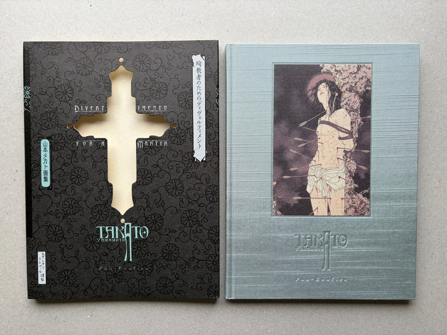 Divertimento for a Martyr – Takato Yamamoto New Black Edition, slipcase and blue-silver cloth hardcover shown side by side