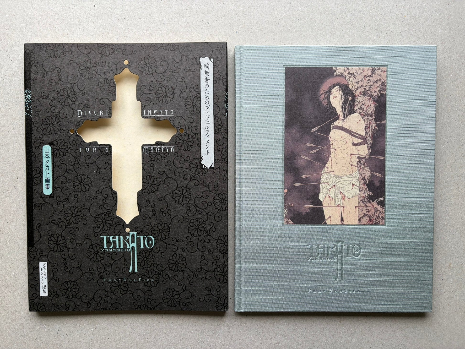 Divertimento for a Martyr – Takato Yamamoto New Black Edition, slipcase and blue-silver cloth hardcover shown side by side