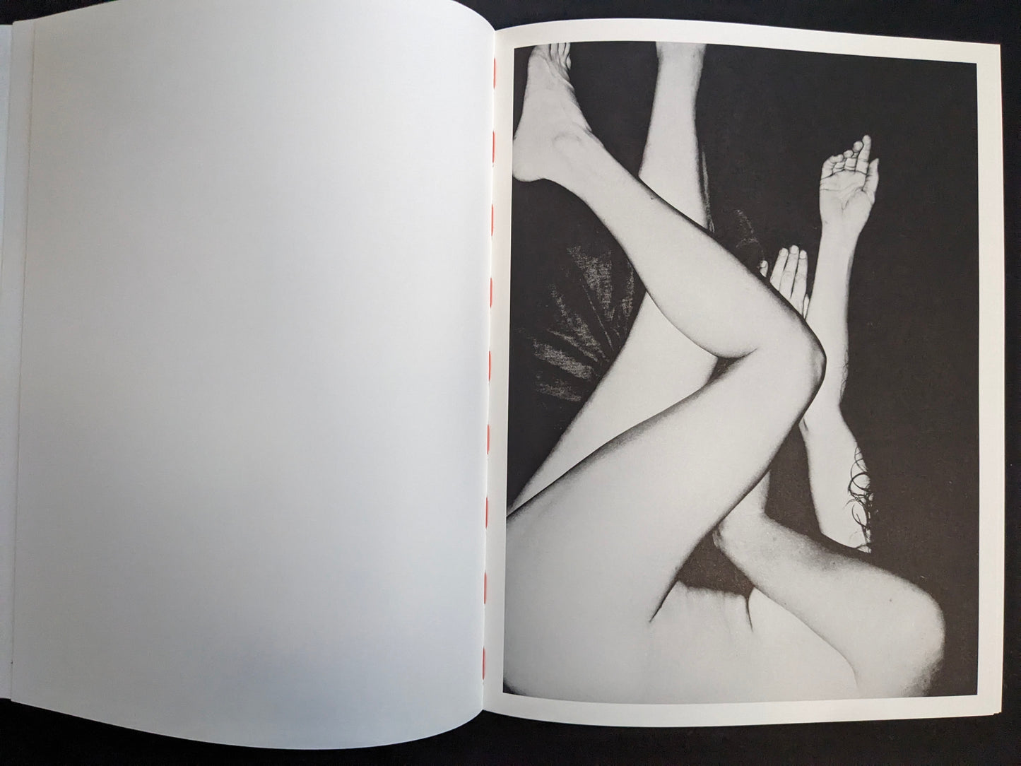 Interior page with a monochrome artistic nude photograph (non-graphic).