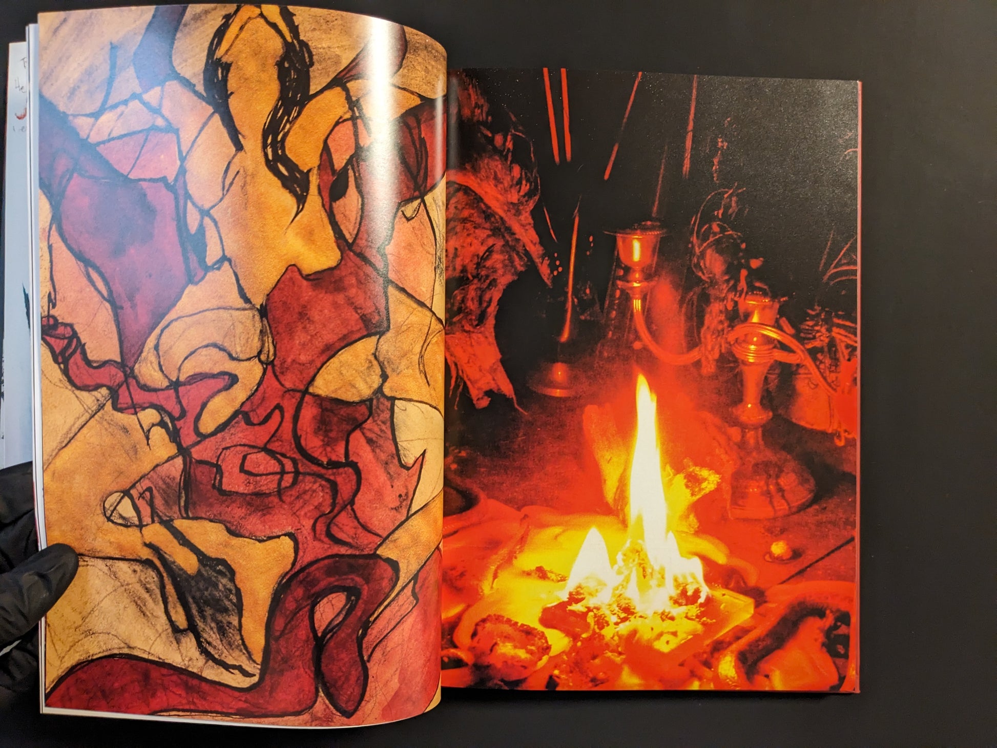 Abstract painting alongside photograph of ritual fire setting