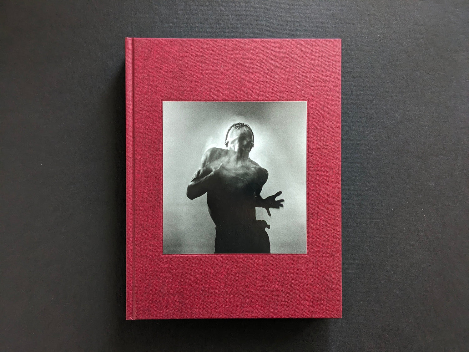 Front cover of Eikoh Hosoe, English edition, with a black-and-white dancer photograph on red cloth