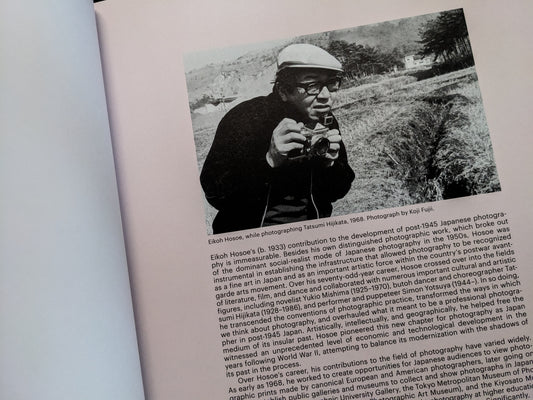 Interior page with Eikoh Hosoe holding a camera beside introductory text