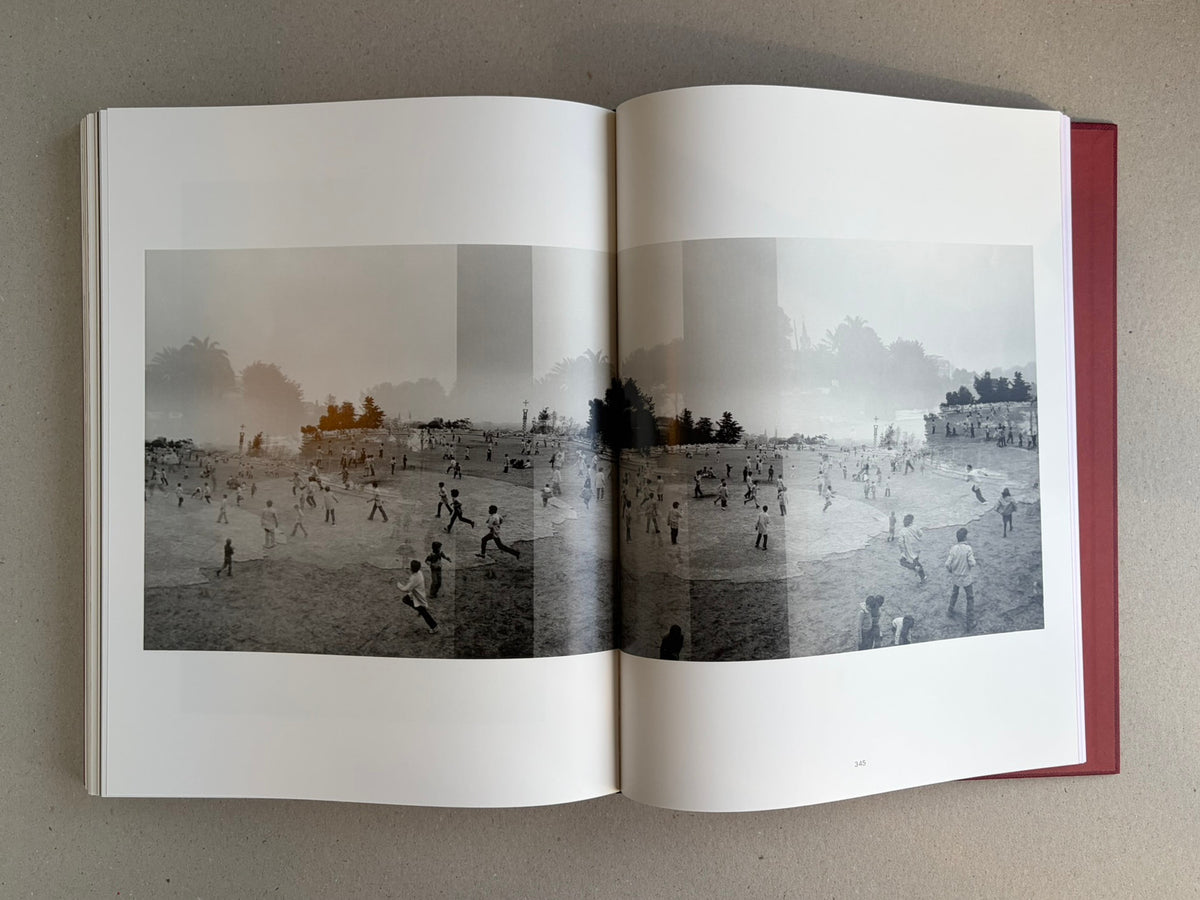 Open spread of Eikoh Hosoe, English edition, showing a black-and-white panoramic photograph across two pages with page number 345 visible.