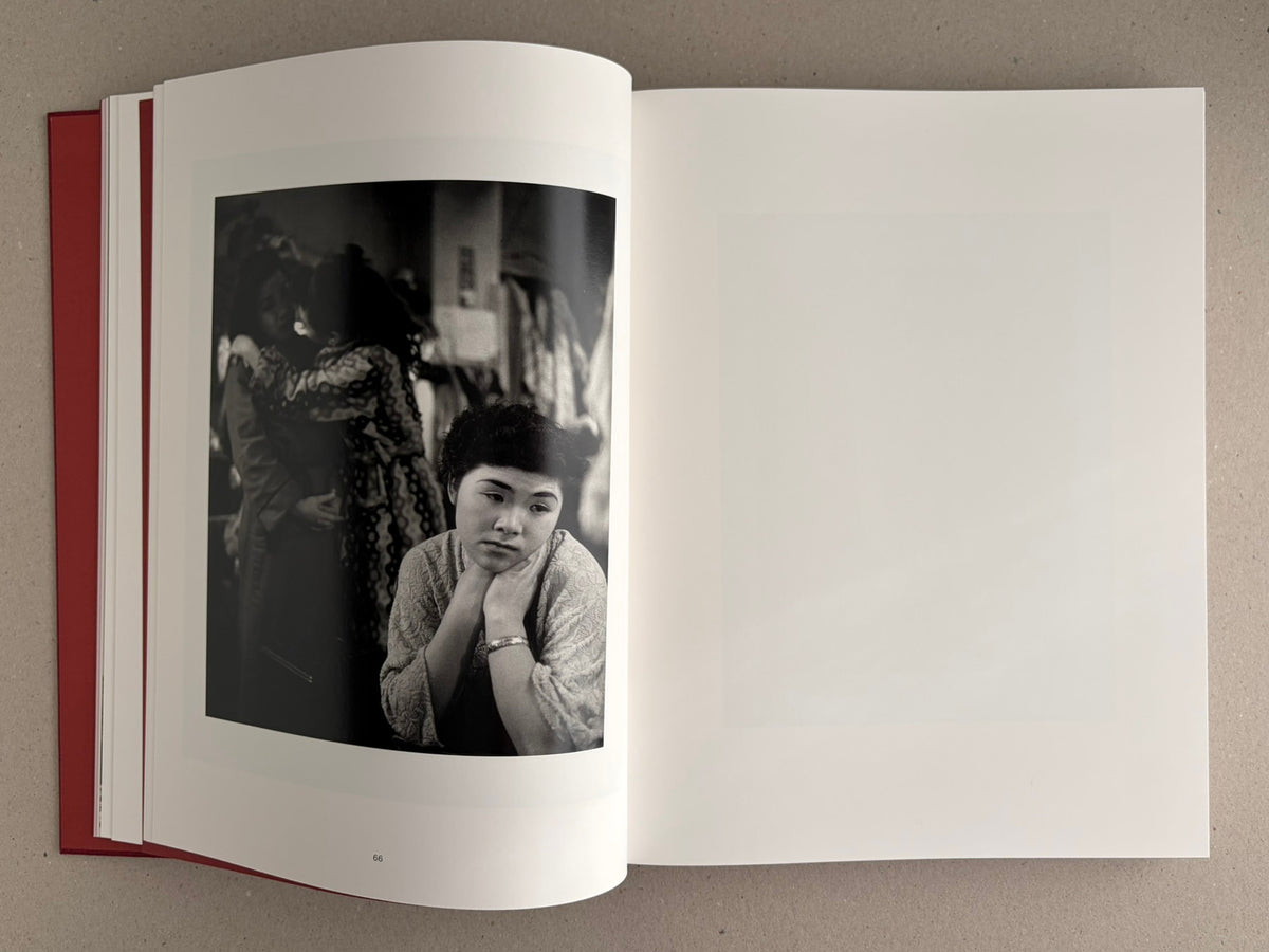 Open spread from Eikoh Hosoe: English edition, showing a black-and-white photograph on the left page and a blank right page.
