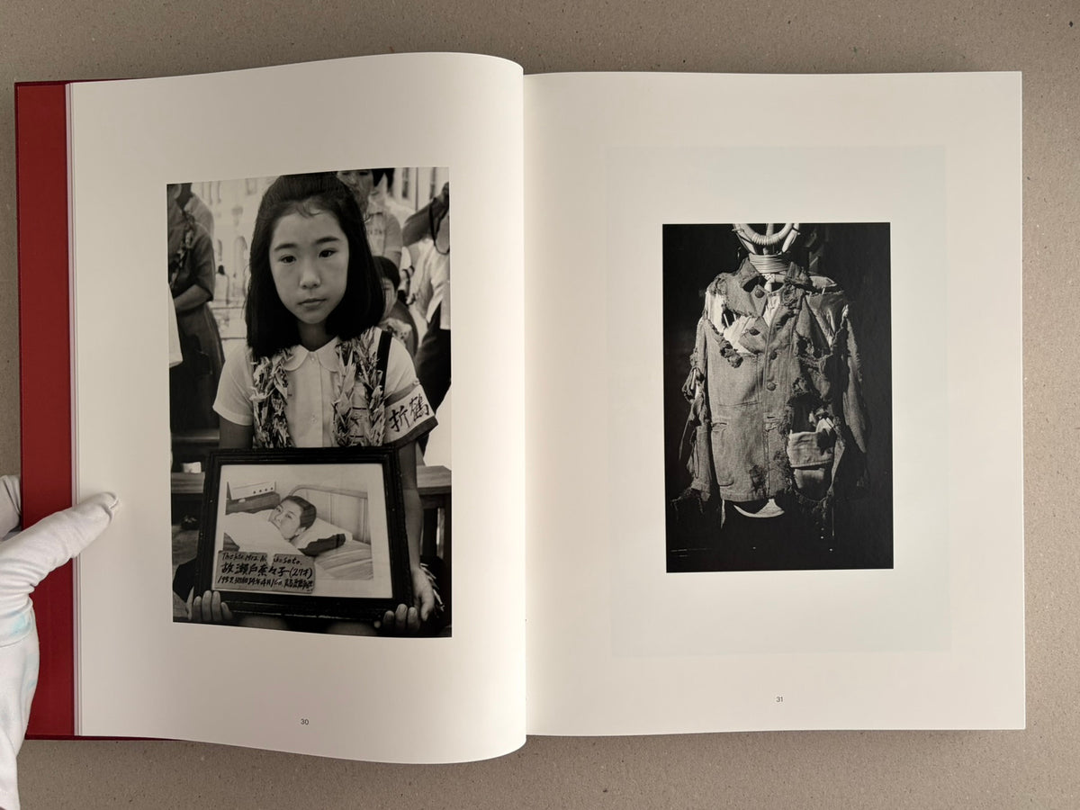 Eikoh Hosoe monograph open to pages 30–31, showing two black-and-white photographs on a spread.