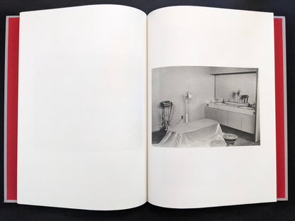 Open spread with a black-and-white interior photograph on the right page in Eros Lost.