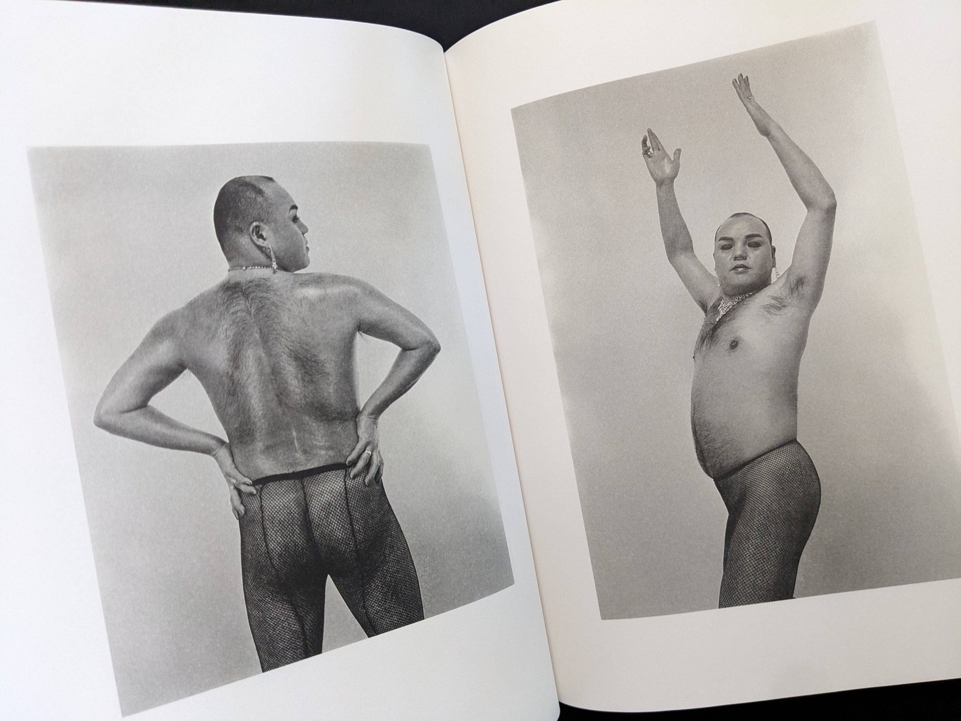 Open spread showing two black-and-white nude portraits in Eros Lost by Seiji Kurata.