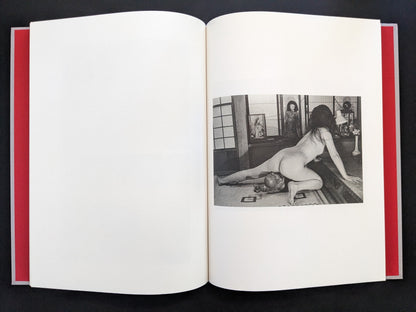 Open spread with a black-and-white nude figure in a Japanese interior on the right page in Eros Lost.