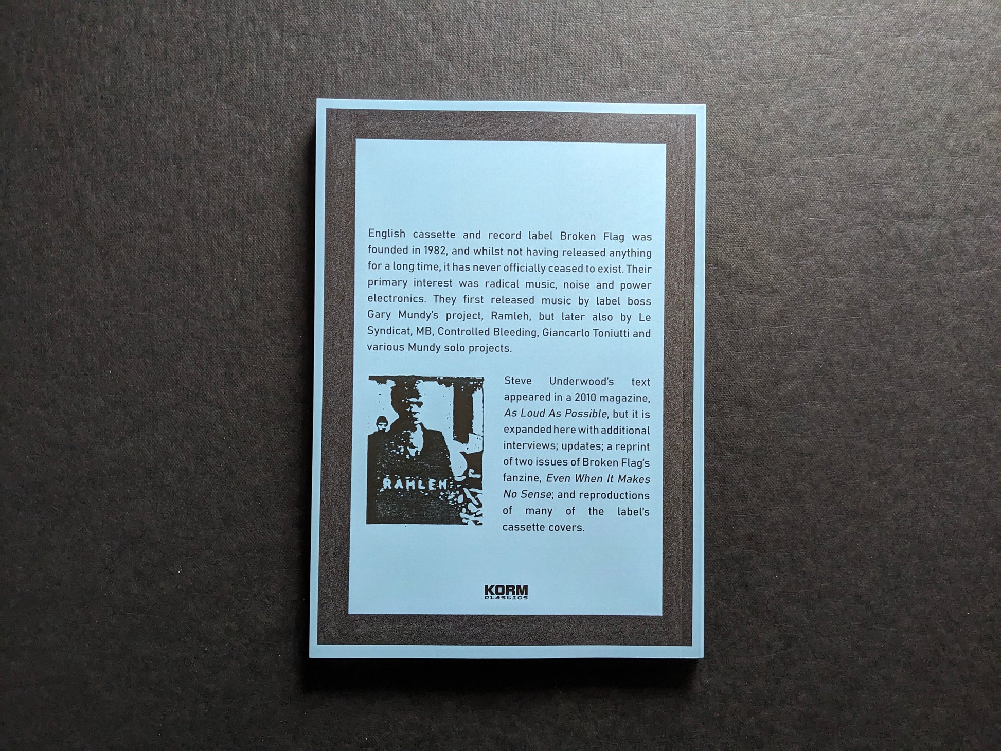 Back cover of Even When It Makes No Sense: the Broken Flag story with publication summary and Korm Plastics logo.