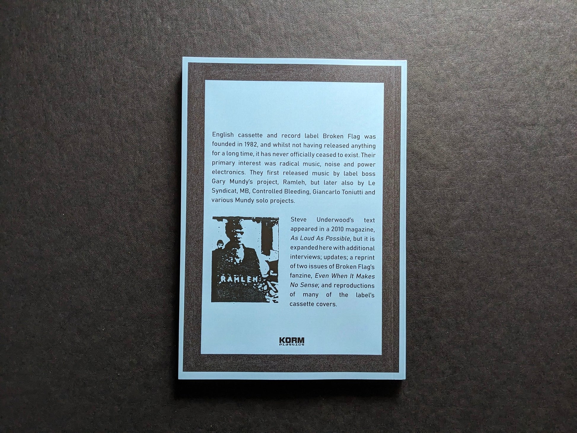 Back cover of Even When It Makes No Sense – the Broken Flag Story with Korm Plastics text.
