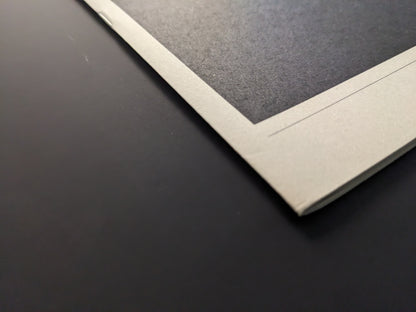 Detail of Far East Obsession photobook corner showing print and paper texture.