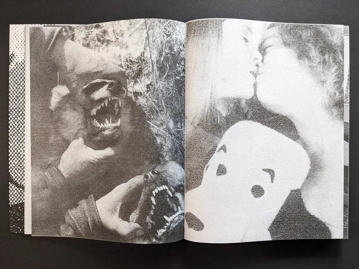Interior spread with snarling dog heads held by hands on the left and a soft-focus cartoon mask on the right.