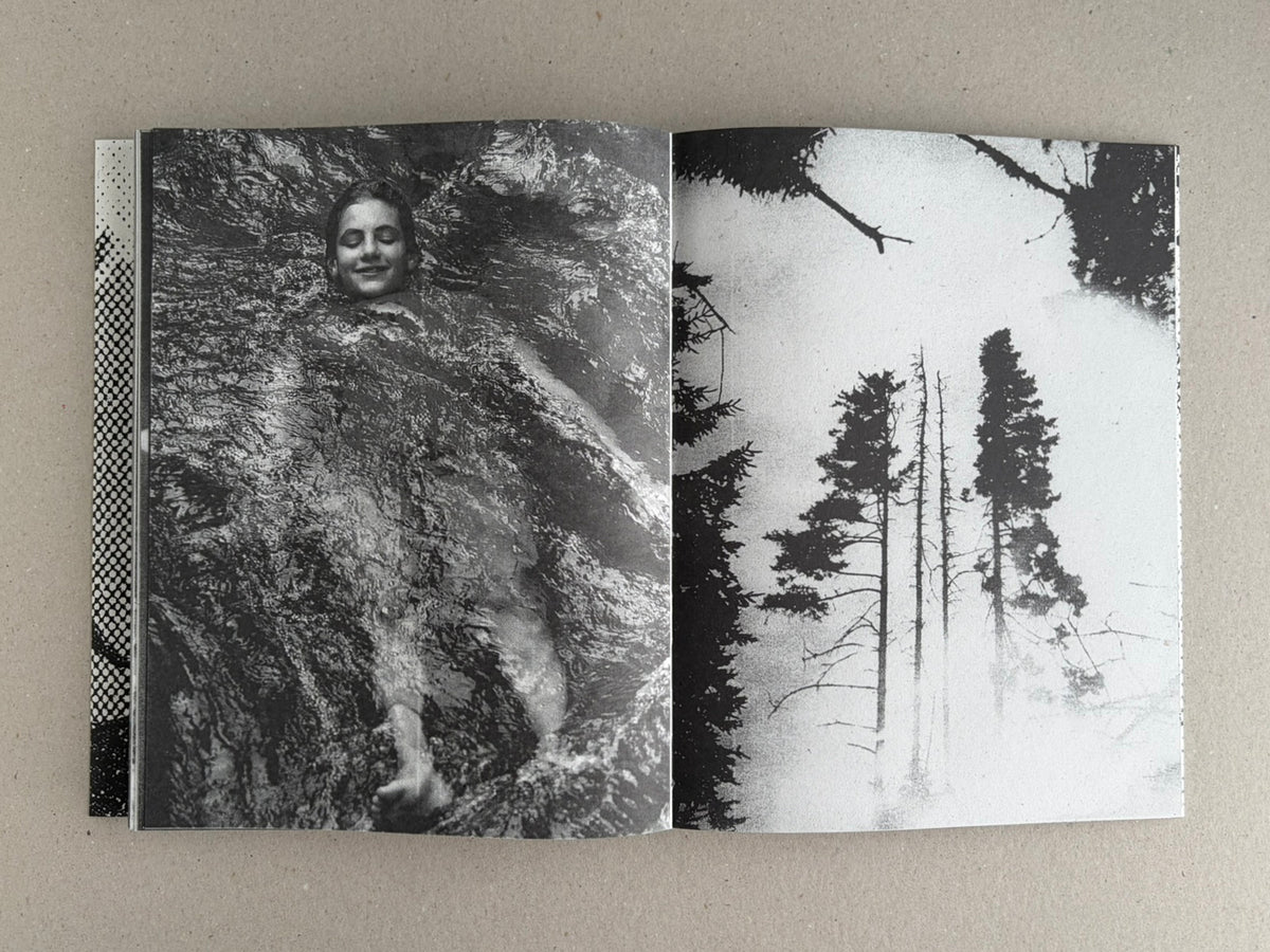 Open spread from Fishworm by Pia Paulina Guilmoth and Jesse Bull Saffire, showing a black-and-white image of a person in water on the left and silhouetted trees against a pale sky on the right.