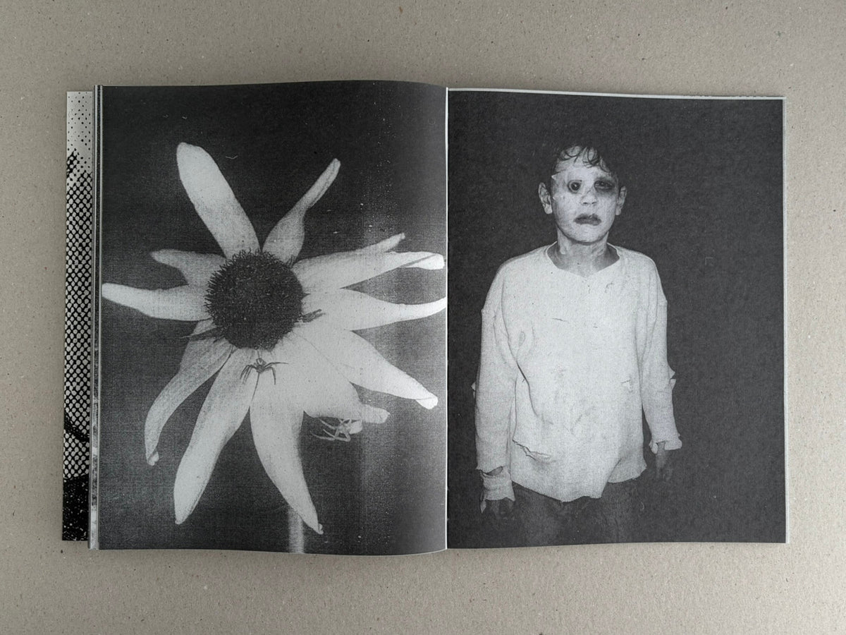 Open spread of Fishworm by Pia Paulina Guilmoth and Jesse Bull Saffire, showing a black-and-white flower on the left page and a portrait of a child on the right.