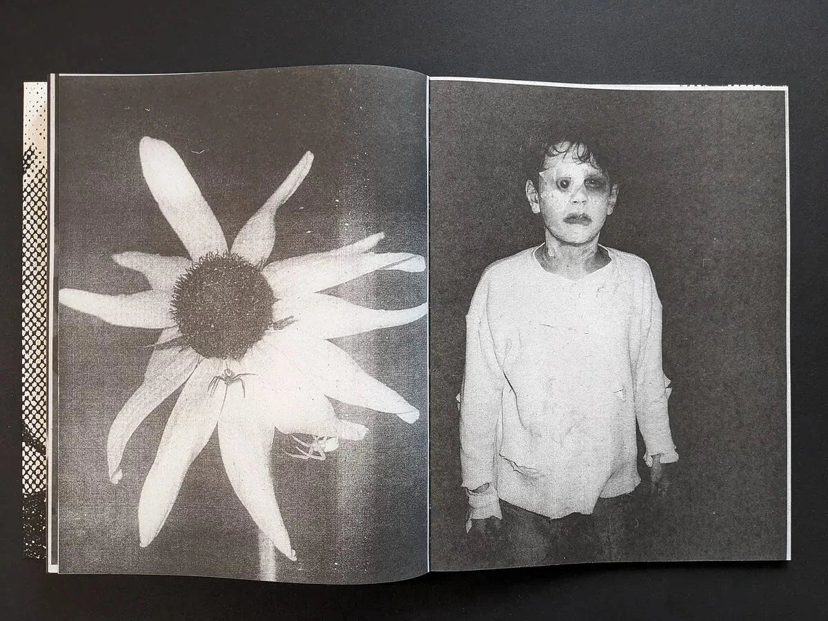 Interior spread from Fishworm showing a large white flower in coarse Xerox texture on the left and a frontal portrait of a child in a plain shirt on the right.
