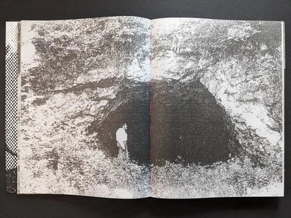 Interior spread from Fishworm showing a dark forest pit surrounded by rough vegetation in heavy Xerox texture.