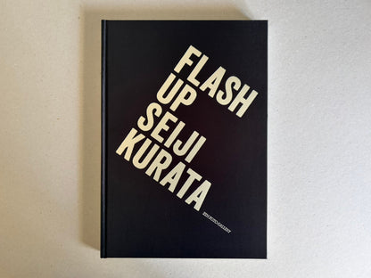 Flash Up by Seiji Kurata, front cover with black background and diagonal title text