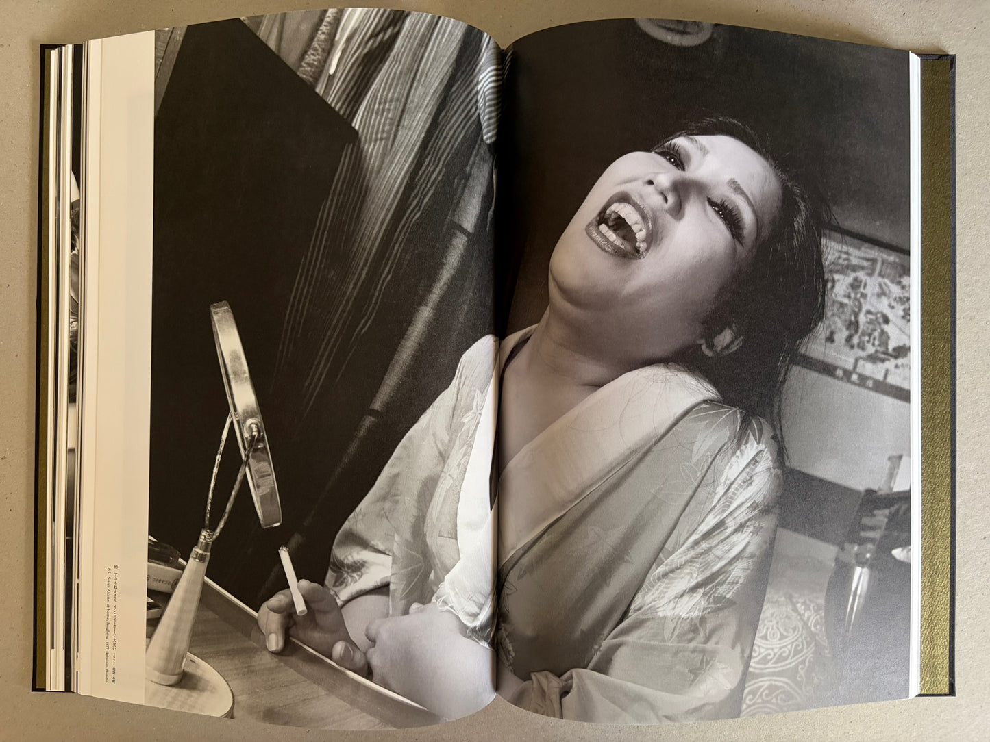 Flash Up by Seiji Kurata, open spread with two black-and-white street photographs