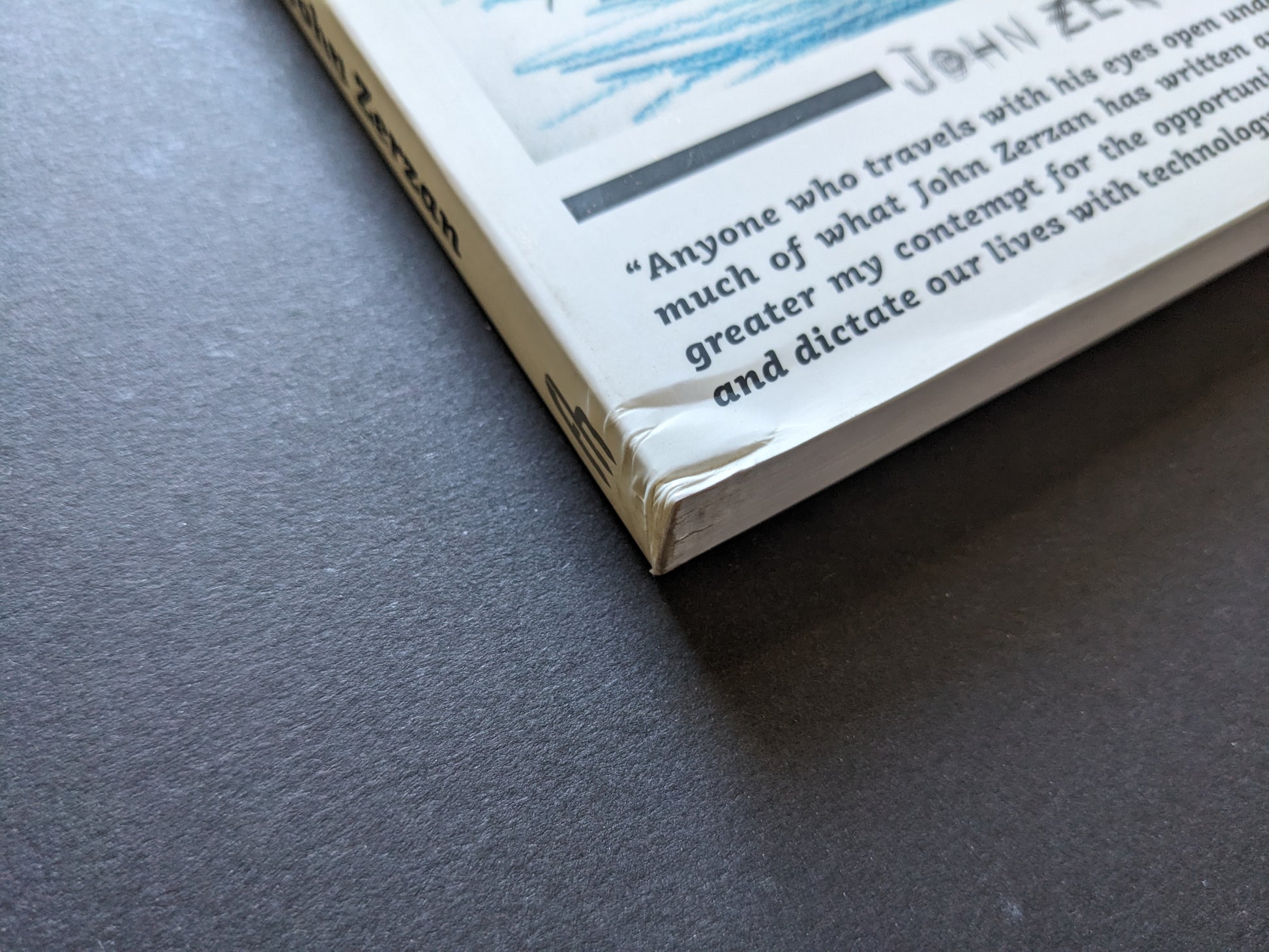 Minor corner damage on bottom edge of Future Primitive Revisited paperback