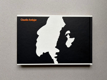 Genocídio do Yanomami by Claudia Andujar, back cover with black-and-white graphic design and orange author name