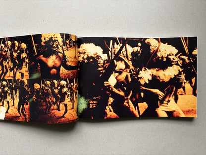 Genocídio do Yanomami by Claudia Andujar, open spread with orange-toned photographs of Yanomami figures