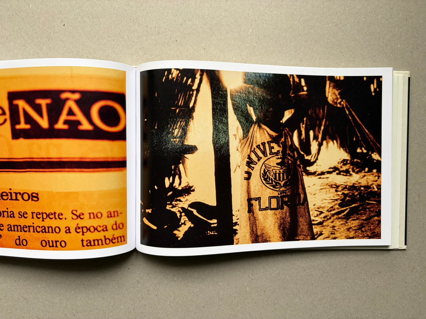 Genocídio do Yanomami by Claudia Andujar, interior spread with large black text and orange overprint