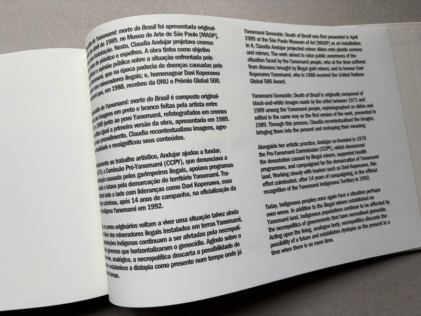 Genocídio do Yanomami by Claudia Andujar, text spread with Portuguese and English paragraphs