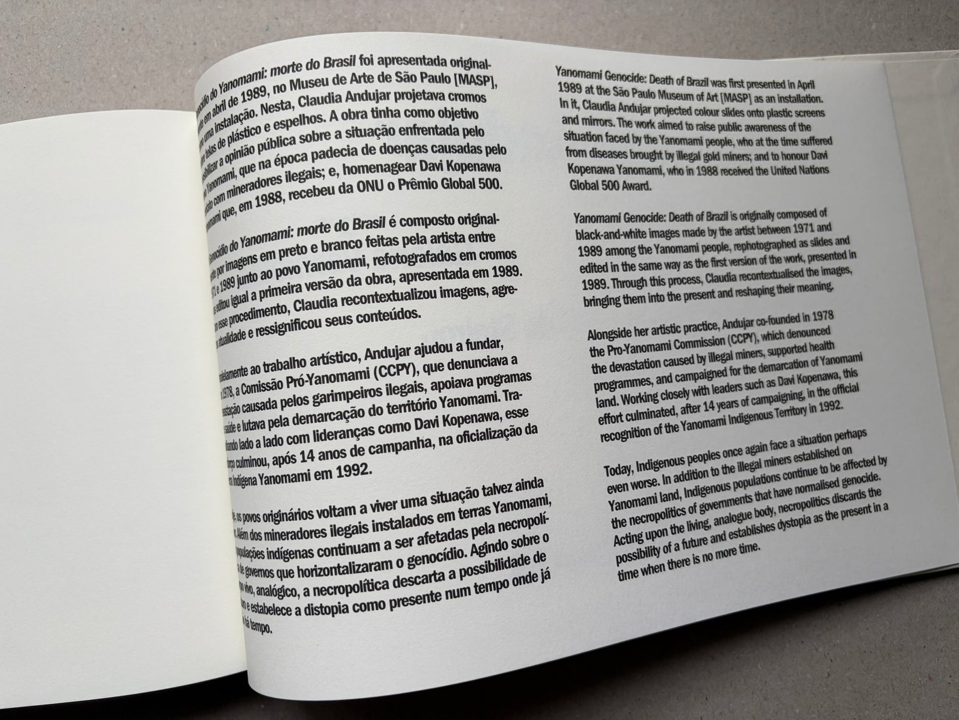 Genocídio do Yanomami by Claudia Andujar, text spread with Portuguese and English paragraphs