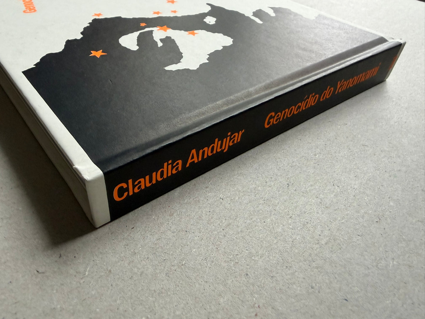 Genocídio do Yanomami by Claudia Andujar, angled view of the hardcover showing the spine and cover