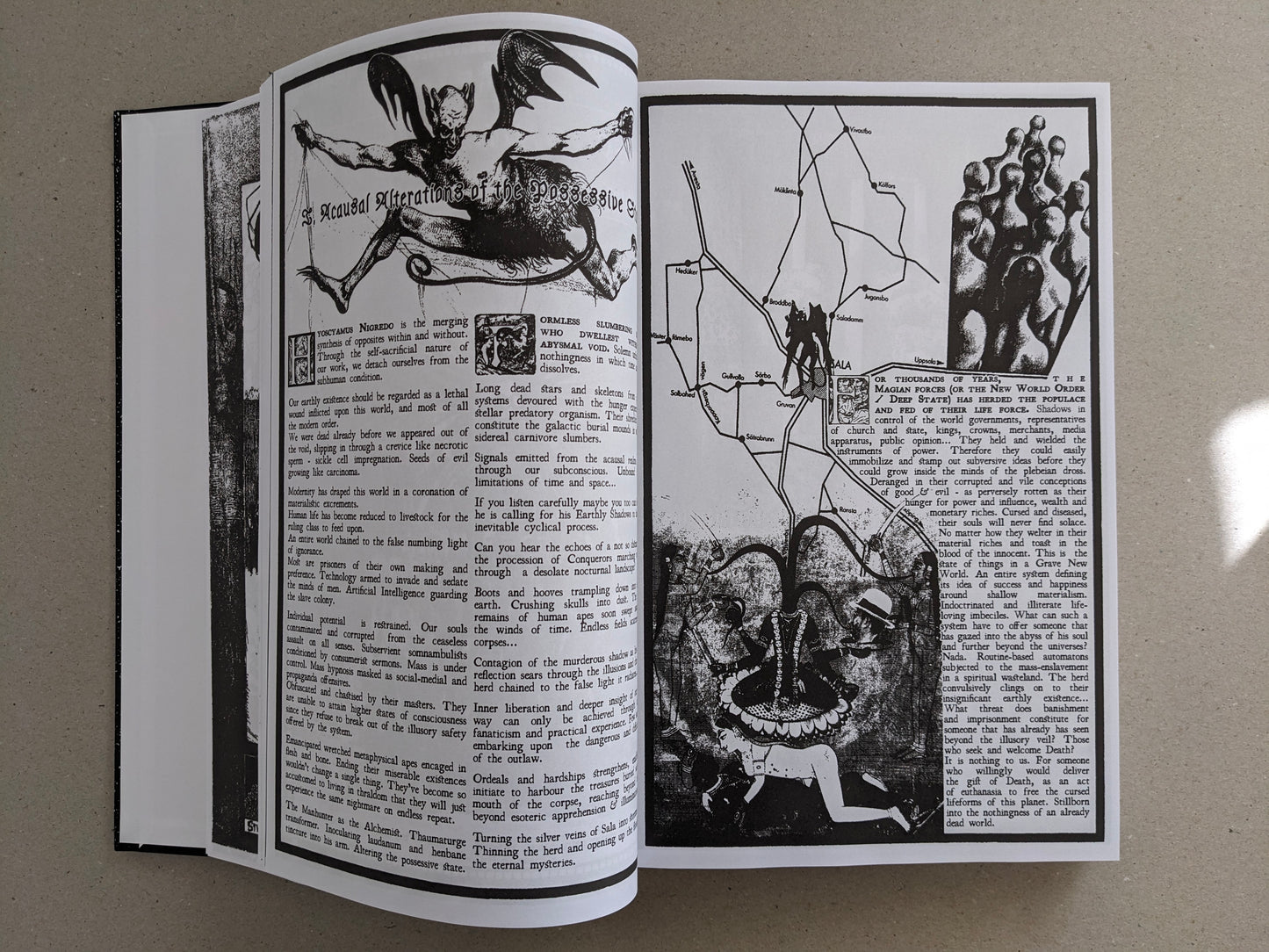 Inside spread with dense text, a winged figure illustration, and a diagram-style city map.