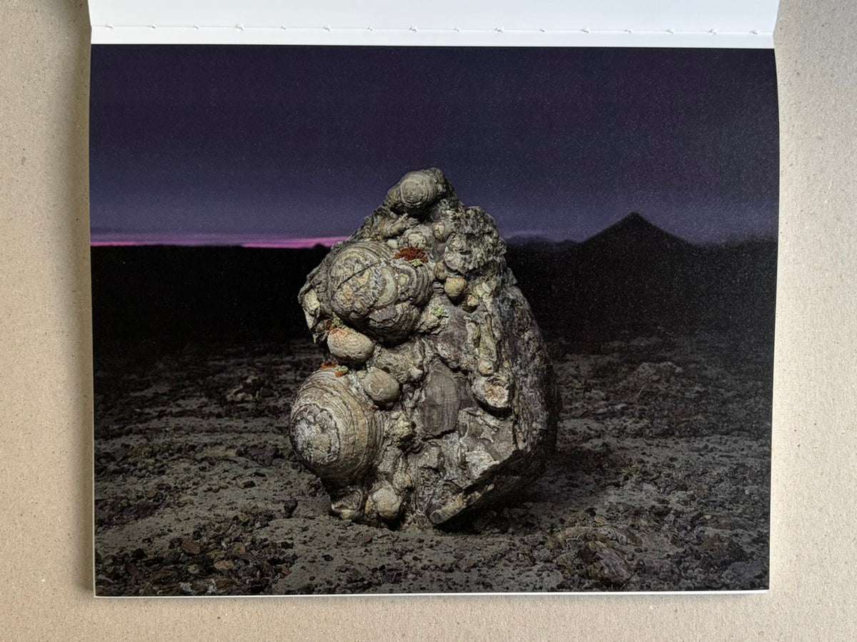 Glass Mountain by Michael Lundgren, open book page showing a dark rock formation under a night sky