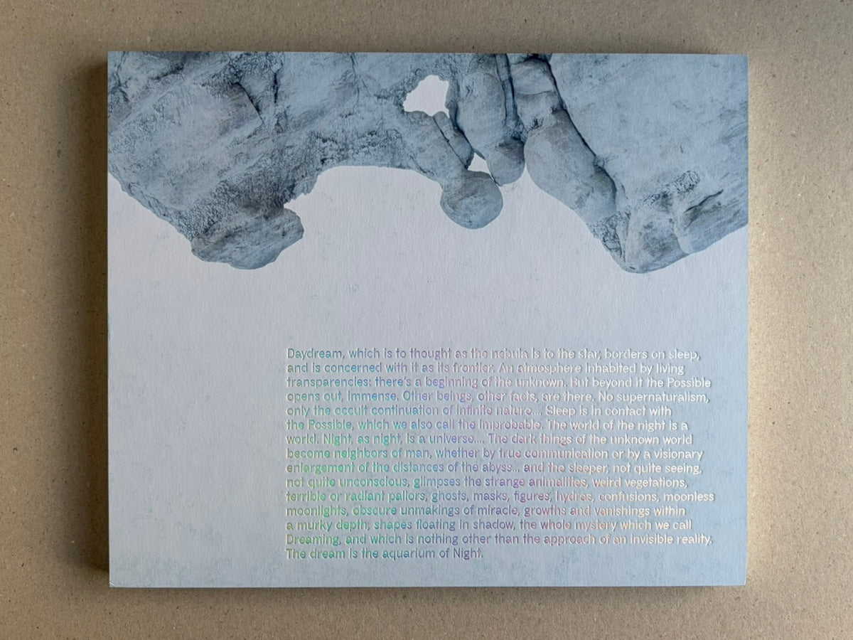Glass Mountain by Michael Lundgren, open book page with a pale blue text page and rock image at the top