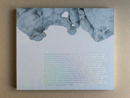 Glass Mountain by Michael Lundgren, open book page with a pale blue text page and rock image at the top