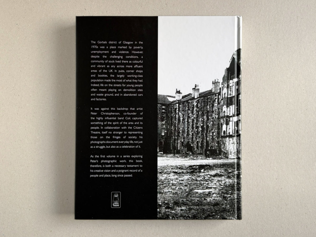 Back cover of Gorbals – Peter Christopherson, showing a black text panel beside a black-and-white photograph of tenement buildings.