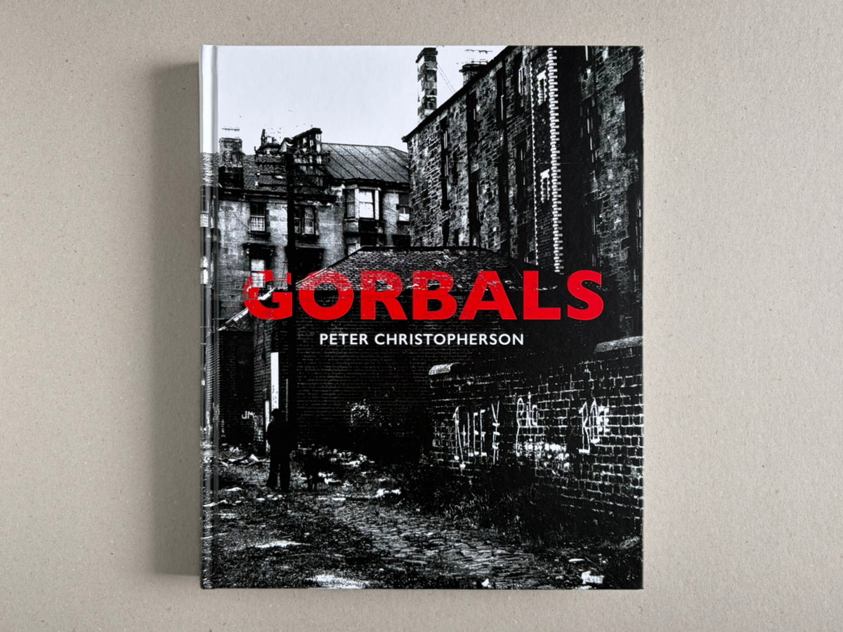 Front cover of Gorbals by Peter Christopherson, showing a black-and-white urban scene with the title in red.