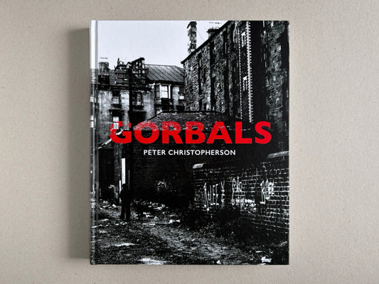 Front cover of Gorbals by Peter Christopherson, showing a black-and-white urban scene with the title in red.
