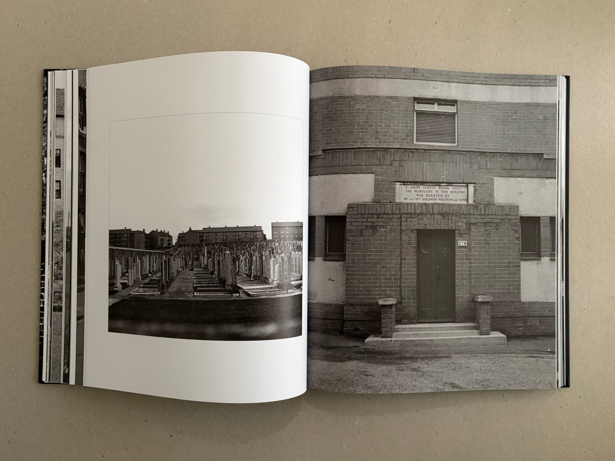 Open spread from Gorbals – Peter Christopherson, showing a black-and-white cemetery photograph on the left page and a brick building facade on the right page.
