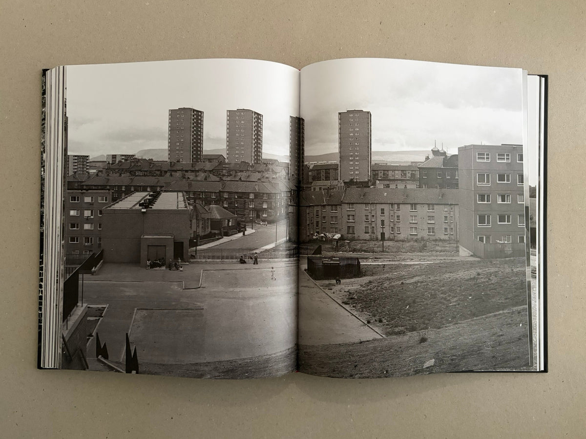 Open spread of Gorbals – Peter Christopherson showing a black-and-white urban landscape with tower blocks and low-rise housing
