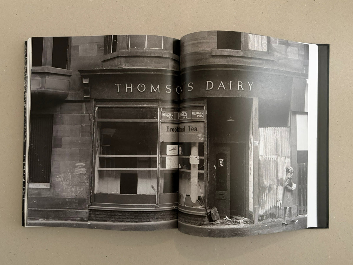 Open spread of Gorbals by Peter Christopherson, showing a black-and-white street photograph with the sign "Thomson's Dairy".