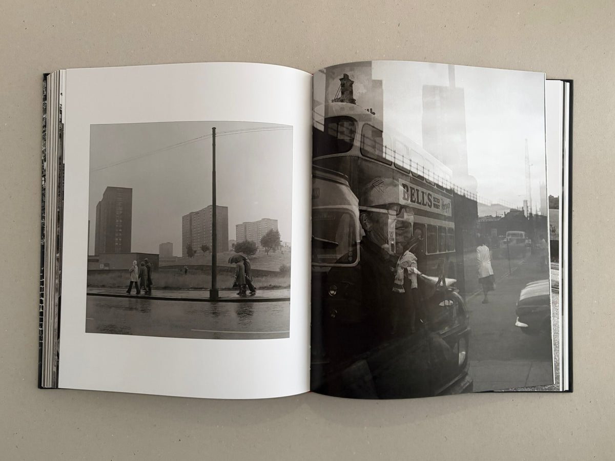 Gorbals – Peter Christopherson open book spread with black-and-white photographs of a rainy street scene and a layered urban image.