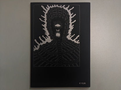 Back cover of Grayworld by Tetsunori Tawaraya featuring silver illustration on black with monstrous face and €13,00 price.