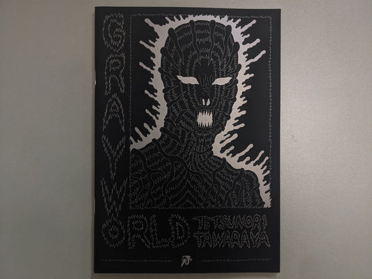 Front cover of Grayworld by Tetsunori Tawaraya with silver ink drawing of alien figure on black background.