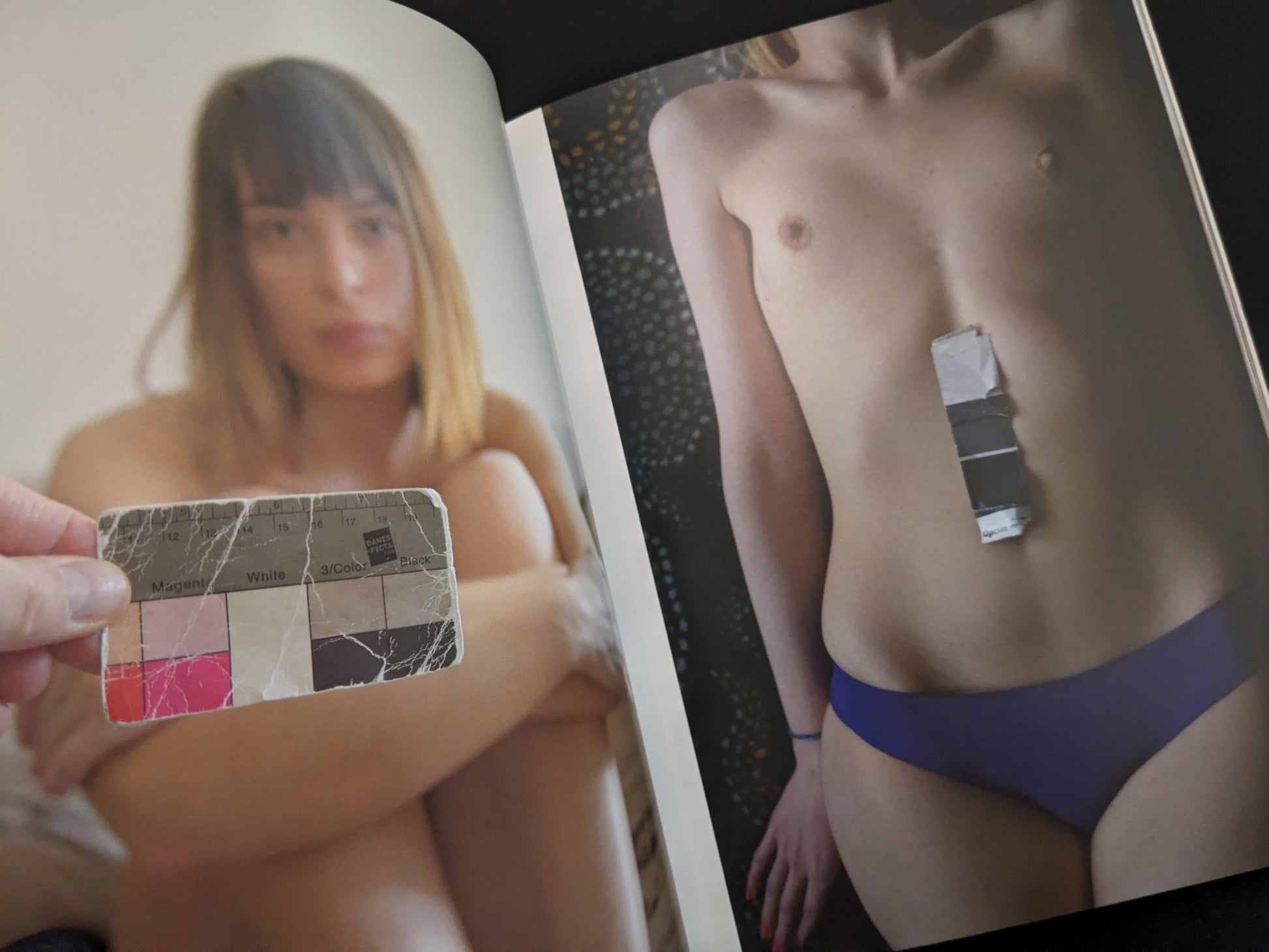 Interior spread from Grey Cards by Richard Kern showing a portrait with a Kodak gray scale card and a nude figure