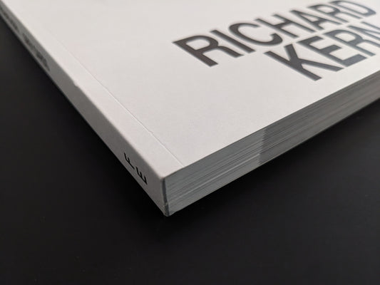 Close-up of the spine and edge of the softcover photobook Grey Cards by Richard Kern