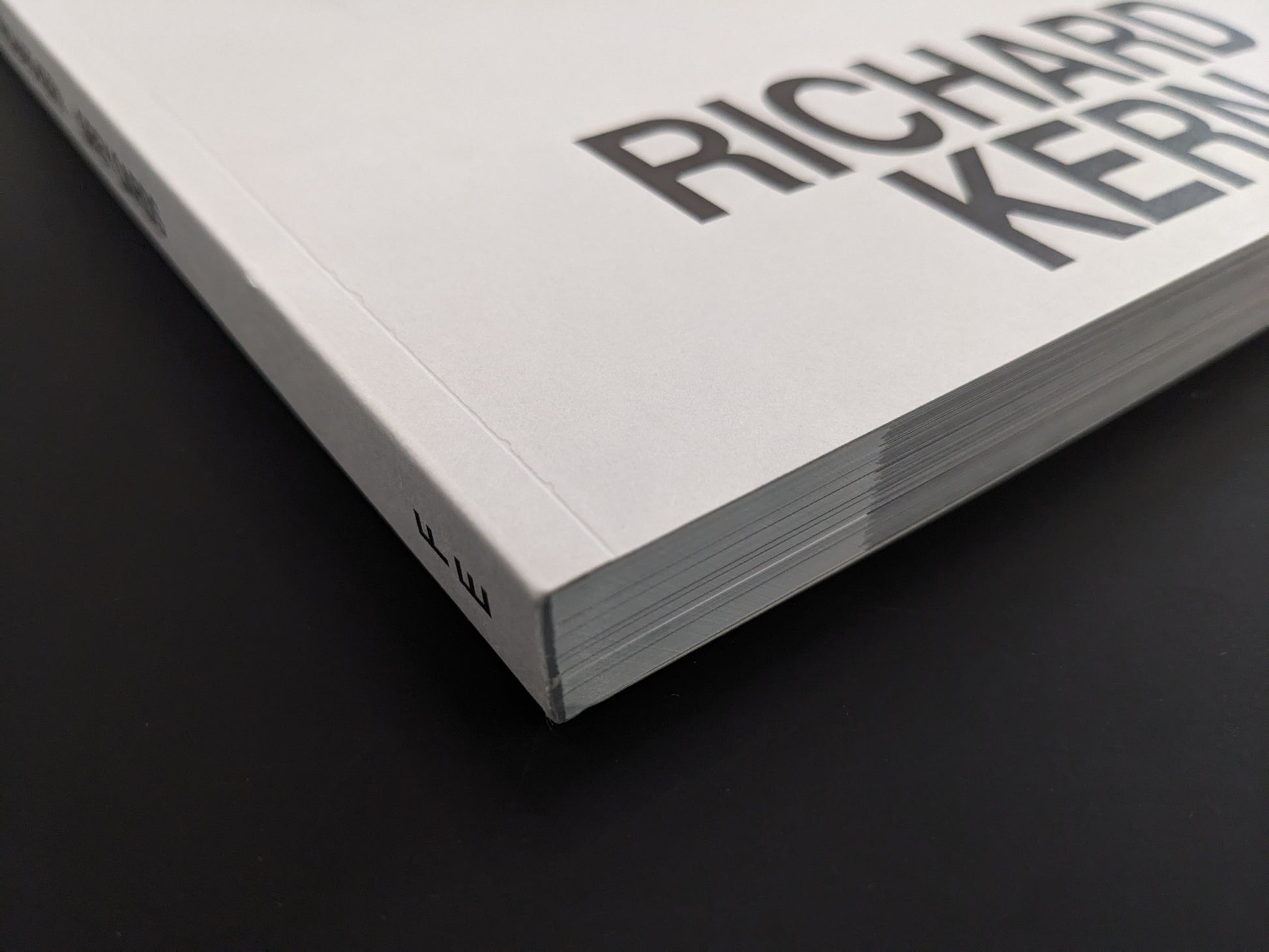 Close-up of the softcover spine and page block of Grey Cards by Richard Kern